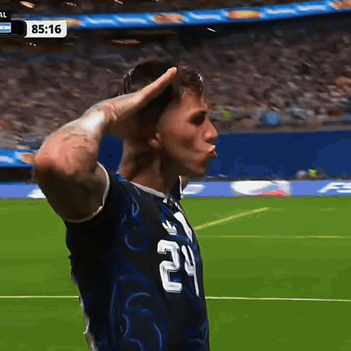 A Soccer Player With The Number 24 On His Shirt Salutes GIF