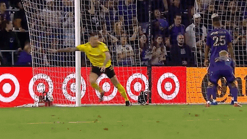 A Soccer Player With The Number 25 On His Jersey Is Jumping In The Air GIF