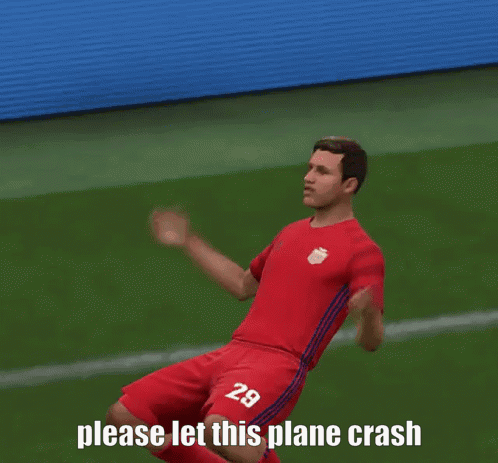 a soccer player with the number 29 on his shirt is kneeling on the field