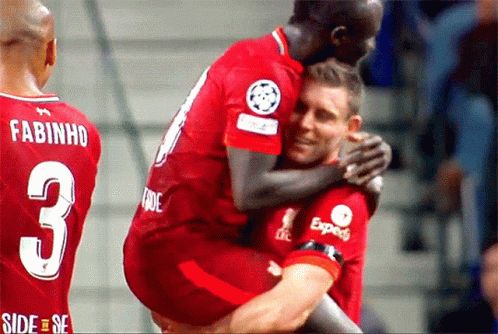 A Soccer Player With The Number 3 On His Back Is Hugging Another Player GIF