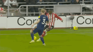 A Soccer Player With The Number 3 On His Jersey Is Kicking A Soccer Ball GIF
