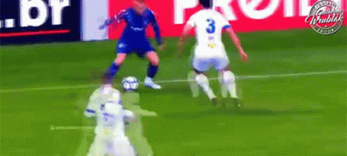 a soccer player with the number 3 on his jersey is kicking the ball