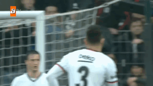 a soccer player with the number 3 on the back of his shirt