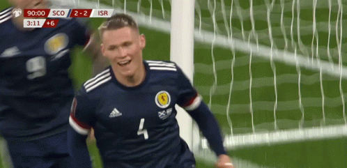 A Soccer Player With The Number 4 On His Jersey Is Celebrating A Goal GIF