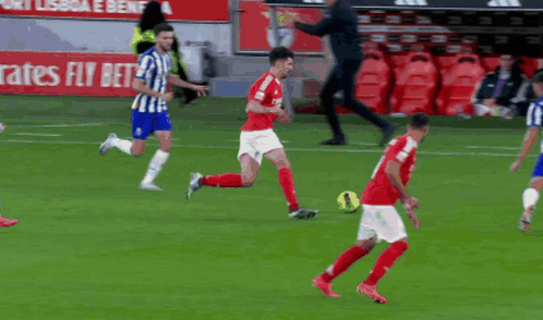 A Soccer Player With The Number 4 On His Jersey Is Kicking A Ball GIF
