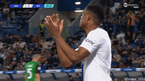 A Soccer Player With The Number 5 On His Jersey Applauds The Crowd GIF