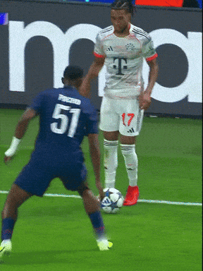 A Soccer Player With The Number 51 On His Jersey Kicks The Ball GIF
