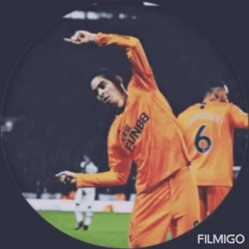a soccer player with the number 6 on his jersey is dancing on the field .