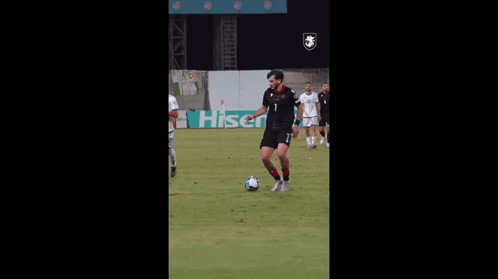A Soccer Player With The Number 6 On His Jersey Kicks The Ball GIF