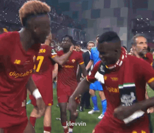 A Soccer Player With The Number 6 On His Shorts Is Dancing With His Teammates GIF