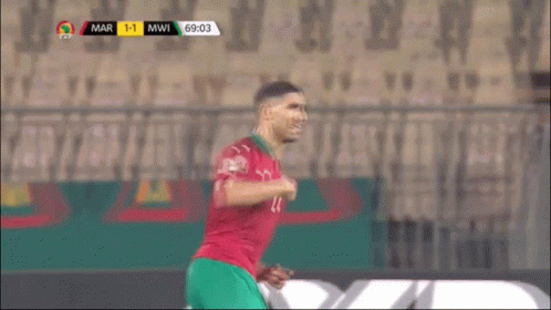 a soccer player with the number 7 on his jersey is running on the field