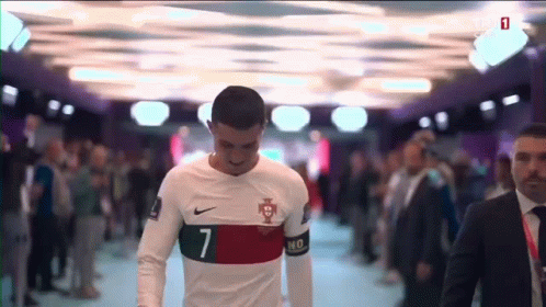 A Soccer Player With The Number 7 On His Jersey Walks Through A Crowd GIF