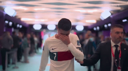 A Soccer Player With The Number 7 On His Shirt Is Covering His Face GIF