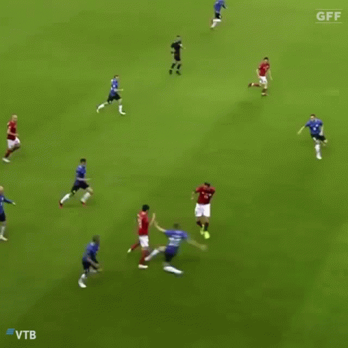A Soccer Player With The Number 8 On His Jersey Is Dribbling The Ball GIF