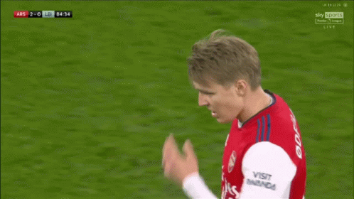 A Soccer Player With The Number 8 On His Shorts Is Bending Over On The Field GIF