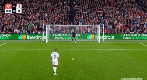 A Soccer Player With The Number 9 On His Jersey Stands In Front Of A Goal GIF