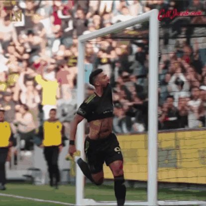 A Soccer Player With The Number 9 On His Shorts Is Running Towards The Goal GIF