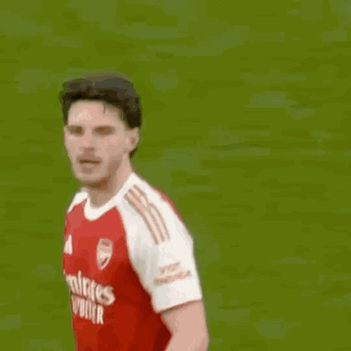 A Soccer Player With The Number 9 On His Shorts Jumps Into The Air GIF