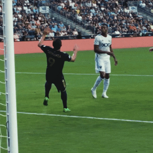 a soccer player with the number 9 on the back of his shirt