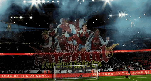 A Soccer Stadium With A Banner That Says The Arsenal GIF