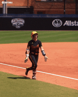 a softball player is running on the field in front of an allstate sign