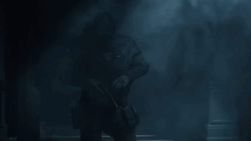 A Soldier In A Dark Room With A Mask On His Face GIF