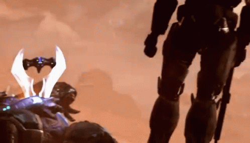 A Soldier Is Standing Next To Another Soldier With A Sword In His Hand . GIF