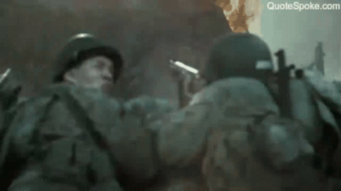 A Soldier Says " Do N't Shoot Let 'Em Burn " In Front Of A Fire GIF