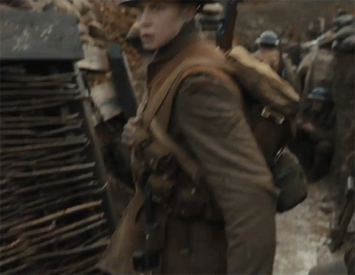 A Soldier Wearing A Helmet And Carrying A Backpack GIF