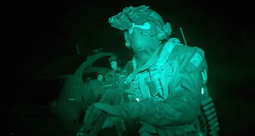 A Soldier Wearing A Helmet With A Patch That Says ' Uk ' On It GIF