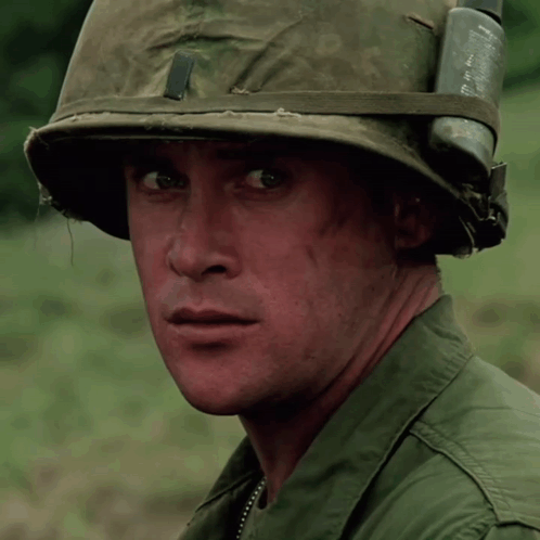 A Soldier Wearing A Helmet With The Letter S On The Front GIF