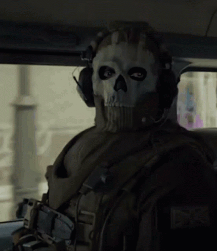 A Soldier Wearing A Skull Mask And Headphones GIF