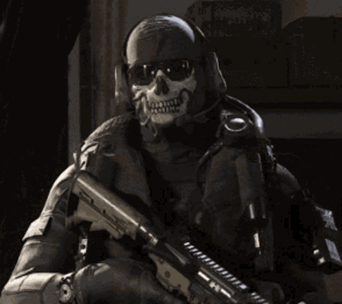 A Soldier Wearing A Skull Mask Holds A Gun GIF