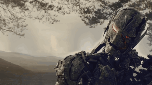 A Soldier With A Helmet That Says ' Us Army ' On It Is Holding A Gun GIF
