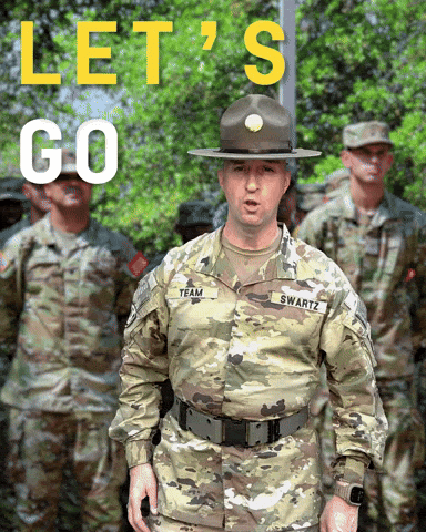 A Soldier With The Name Swartz On His Uniform Stands In Front Of A Group Of Other Soldiers GIF