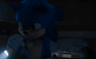 A Sonic The Hedgehog Holding A Flashlight In The Dark GIF