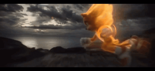 A Sonic The Hedgehog Is Flying Through The Air With A Cloudy Sky In The Background GIF