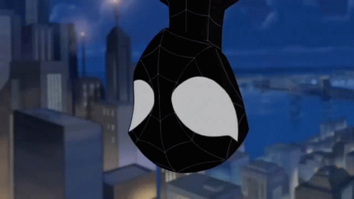 A Spider Man Hanging Upside Down In A City GIF