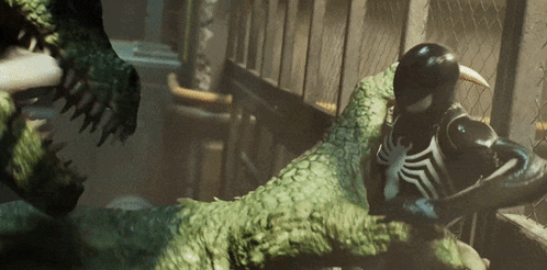 A Spider Man Is Fighting A Crocodile In A Dark Room GIF