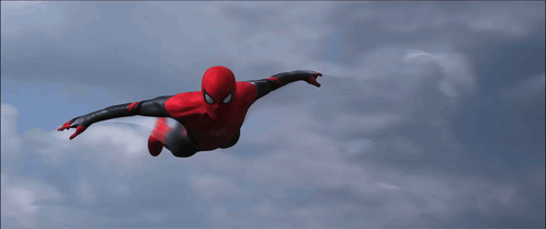 a spider man is flying through the air with his arms outstretched
