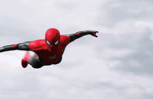 a spider man is flying through the air with his arms outstretched .