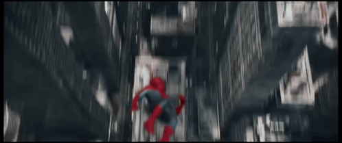 a spider man standing in front of a city skyline