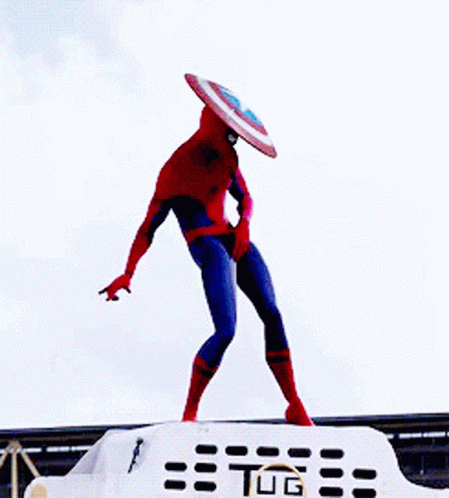 A Spiderman With A Shield On His Head Is Standing On Top Of A Tug GIF