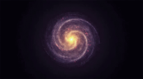 A Spiral Galaxy In The Night Sky With A Yellow Center GIF