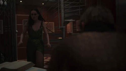 A Spiral Staircase In A Dark Room With A Compass In The Middle GIF