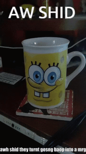 A Spongebob Mug Sits On A Coaster On A Table GIF