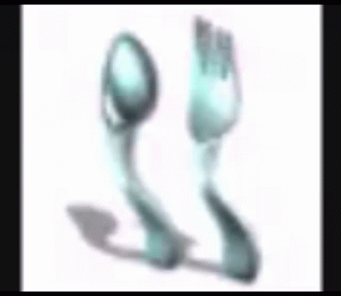 A Spoon And A Fork With A Foot In The Background GIF