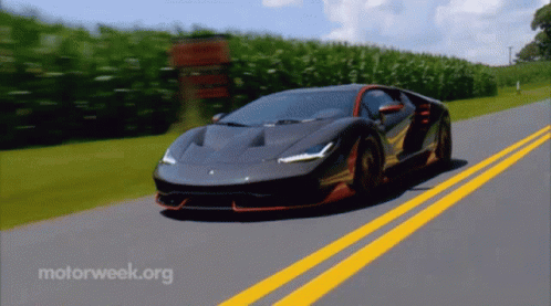 A Sports Car Is Driving Down A Road With Motorweek.org Written On The Bottom GIF