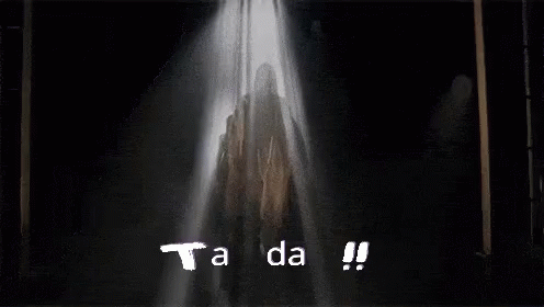 A Spotlight Shines On The Word Tanda Which Is On A Black Background GIF