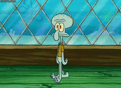 A Squidward From Spongebob Squarepants Is Standing In Front Of A Chain Link Fence . GIF